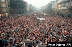 FILE - In this Nov. 21, 1989 file photo about 200,000 people gather in Wenceslas Square, Prague, Czechoslovakia. Dubbed the “Velvet Revolution” for its non-violent nature, the protests led to the resignation of the Communist Party's leadership. (AP Photo/Peter Dejong, File)