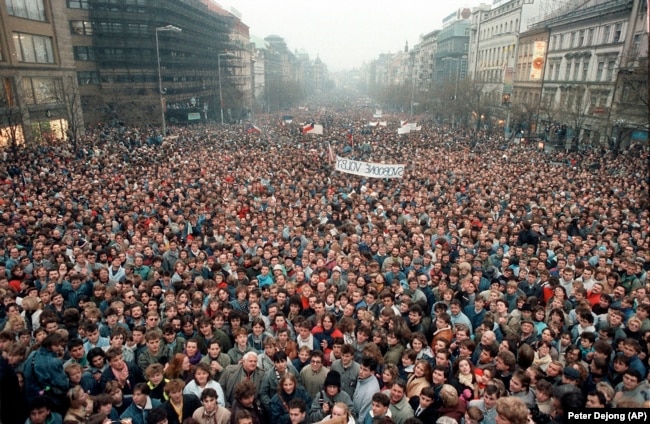 FILE - In this Nov. 21, 1989 file photo about 200,000 people gather in Wenceslas Square, Prague, Czechoslovakia. Dubbed the “Velvet Revolution” for its non-violent nature, the protests led to the resignation of the Communist Party's leadership. (AP Photo/Peter Dejong, File)