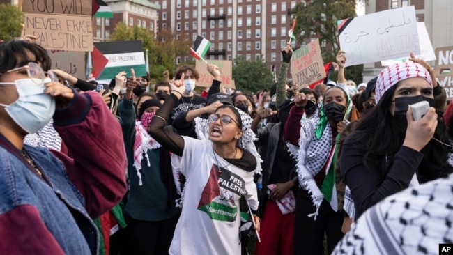 FILE - Palestinian supporters gather for a protest at Columbia University, New York, Oct. 12, 2023.