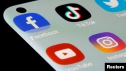 FILE - Apps, including Facebook, TikTok, YouTube and Instagram, are seen on a smartphone in this illustration from July 13, 2021.