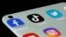 FILE - Facebook, TikTok, Twitter, YouTube and Instagram apps are seen on a smartphone in this illustration taken July 13, 2021.