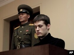 FILE - Matthew Miller, a U.S. citizen, sits on the dock at the Supreme Court during his trial in Pyongyang, North Korea, Sept. 14, 2014.