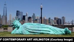 Zaq Landsberg, Reclining Liberty, 2021, Installation view from Liberty State Park, New Jersey