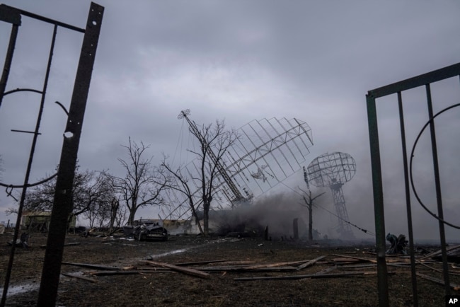 FILE - Smoke rises from an air defense base in the aftermath of an apparent Russian strike in Mariupol, Ukraine, Thursday, Feb. 24, 2022. (AP Photo/Evgeniy Maloletka, File)