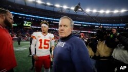 FILE - New England Patriots head coach Bill Belichick, center, turns away after shaking hands with Kansas City Chiefs quarterback Patrick Mahomes (15) following an NFL football game, Dec. 17, 2023, in Foxborough, Mass.