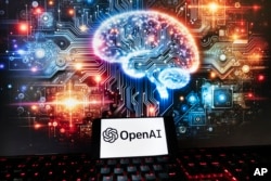 Logo OpenAI ditampilkan di ponsel dengan gambar di monitor komputer yang dihasilkan oleh model text-to-image Dall-E ChatGPT, Jumat, 8 Desember 2023, di Boston. (Foto: AP)