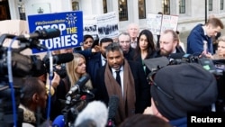 Toufique Hossain representing asylum seekers, speaks to the media outside the Supreme Court following its ruling on whether the government can go ahead with its plan to deport migrants to Rwanda, in London, Nov. 15, 2023. 