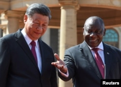 FILE - South Africa's President Cyril Ramaphosa welcomes China's President Xi Jinping at the Union Buildings ahead of the BRICS emerging economies meeting, in Pretoria, South Africa, Aug. 22, 2023.