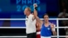 Algeria's Imane Khelif gestures after defeating Thailand's Janjaem Suwannapheng in their women's 66 kg semifinal boxing match at the 2024 Summer Olympics, Aug. 6, 2024, in Paris.