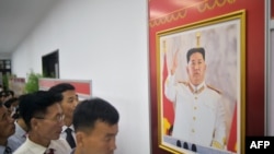In this photo taken in Pyongyang, North Korea, on July 19, 2023, people visit the National Photo Exhibition at the People's Palace of Culture to celebrate the 70th anniversary of the end of the Korean War. 
