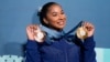 FILE - Jordan Chiles, of the United States, holds up her medals after the women's artistic gymnastics individual apparatus finals Bercy Arena at the 2024 Summer Olympics, in Paris, France, Aug. 5, 2024.