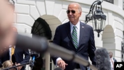 President Joe Biden speaks to reporters in Washington as he departs the White House for a trip to New Orleans, Louisiana, Aug. 13, 2024.