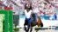 France's Marie Oteiza falls will riding Babouchka de la Bride IFCE during the final riding show of the women's individual in the modern pentathlon at the 2024 Summer Olympics, Aug. 11, 2024, in Versailles, France. 