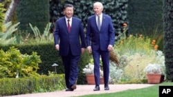 FILE — U.S. President Joe Biden and China's President Xi Jinping meet in Woodside, California, Nov. 15, 2023. The Biden administration says its diplomacy, discussions and cooperation with China has reduced tension between the rivals. (Doug Mills/The New York Times via AP, Pool)
