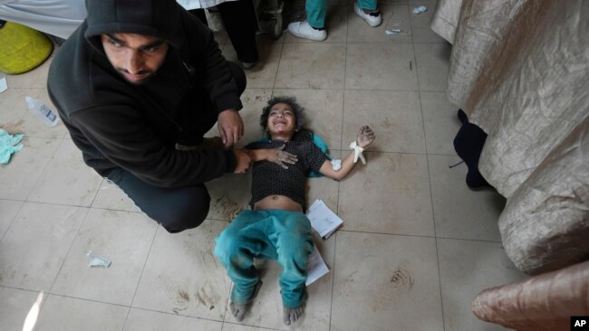 Palestinians wounded in the Israeli bombardment of the Gaza Strip are brought to Al Aqsa hospital in Deir al Balah, Gaza Strip, March 8, 2024.