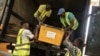 National Elections Commission agents load trucks with election material in Monrovia, on Oct. 9, 2023. 