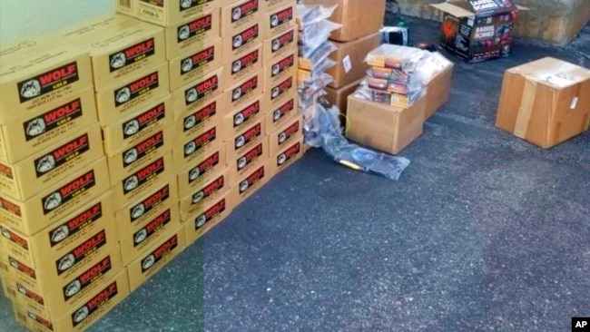 This undated photo provided by the United States Department of Justice shows boxes of ammo displayed after confiscation.
