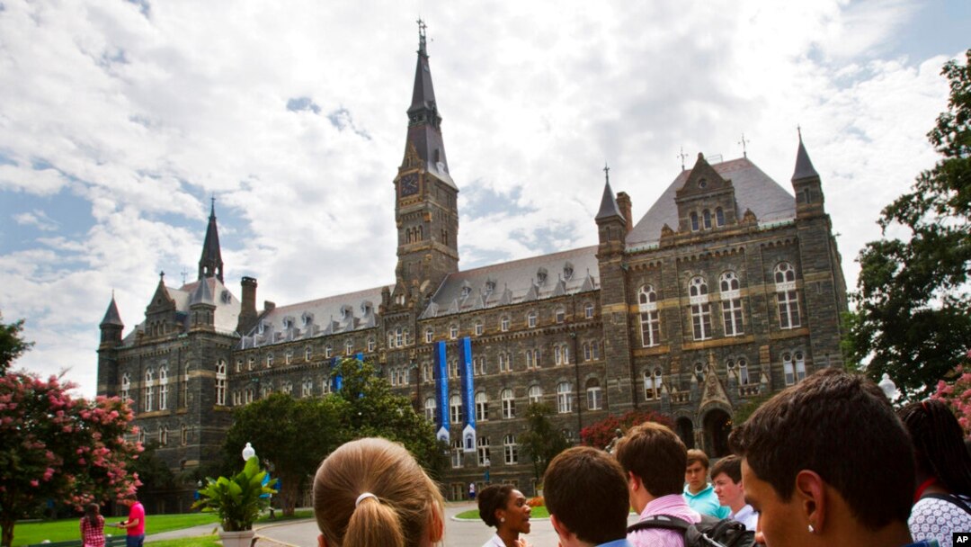 FILE - Prospective students tour Georgetown University' on July 10, 2013, in Washington.