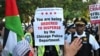 Protesters tear down security fence, thousands march outside Democratic National Convention   