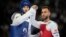Palestinian Omar Yaser Ismail, left, competes with Refugees Olympic Team's Hadi Tiranvalipour in a men's 58kg Taekwondo match during the 2024 Summer Olympics, at the Grand Palais, in Paris, France, Aug. 7, 2024.