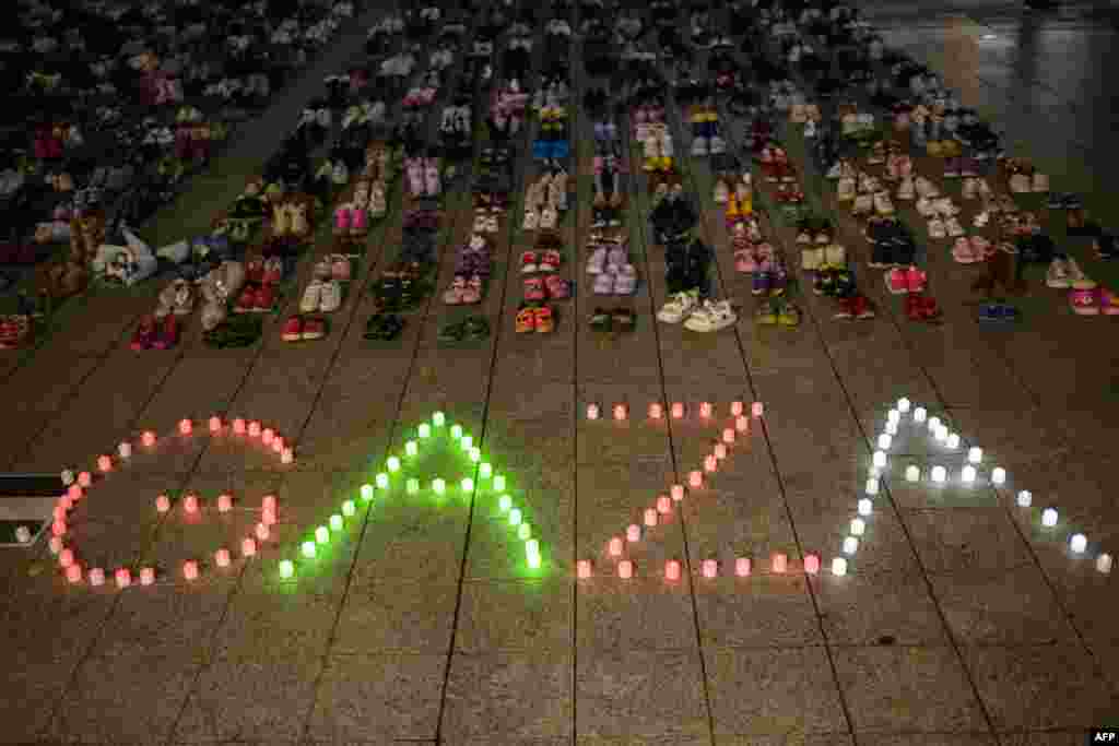 Shoes are displayed to symbolize the victims from Gaza, West Bank and Israel after a rally in solidarity with the Palestinian people in Seoul.