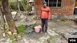 Biri Lal had to walk far to fetch water until a tap was installed in his house under a nationwide program to provide piped water to rural households. (Rakesh Kumar/VOA)