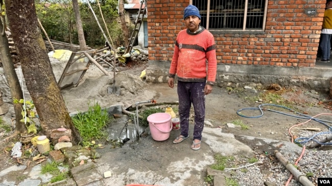 Biri Lal had to walk far to fetch water until a tap was installed in his house under a nationwide program to provide piped water to rural households. (Rakesh Kumar/VOA)