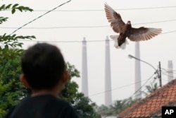 Steams spew from the chimneys of a coal power plant, in Cilegon, Banten province, Indonesia, on Oct. 3, 2023.