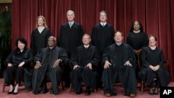 FILE - The nine U.S. Supreme Court justices are seen in a Oct. 7, 2022, photo. Bottom from left, Sonia Sotomayor, Clarence Thomas, Chief Justice John Roberts, Samuel Alito, Elena Kagan. Top from left, Amy Coney Barrett, Neil Gorsuch, Brett Kavanaugh, and Ketanji Brown Jackson.