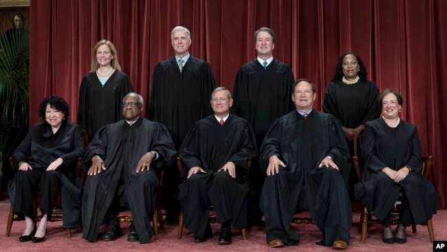 FILE - The nine U.S. Supreme Court justices are seen in a Oct. 7, 2022, photo. Bottom from left, Sonia Sotomayor, Clarence Thomas, Chief Justice John Roberts, Samuel Alito, Elena Kagan. Top from left, Amy Coney Barrett, Neil Gorsuch, Brett Kavanaugh, and Ketanji Brown Jackson.