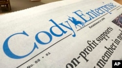 A recent issue of the Cody Enterprise, the Wyoming newspaper where a reporter used artificial intelligence to help write his stories, is seen Tuesday, Aug. 13, 2024, at the Wyoming State Library in Cheyenne. (AP Photo/Mead Gruver)