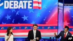 Republican presidential candidates from left, former UN Ambassador Nikki Haley, Florida Gov. Ron DeSantis, and businessman Vivek Ramaswamy participate in a Republican presidential primary debate Nov. 8, 2023, in Miami. 