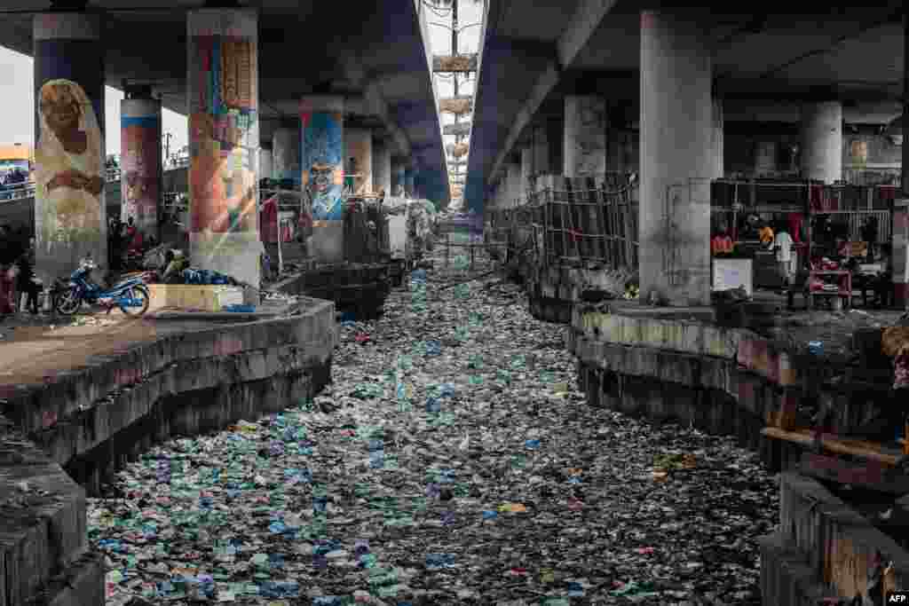 A clogged up canal filled with styrofoam and single use plastic is seen at Obalende in Lagos, Nigeria, Jan. 23, 2024.