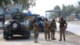 FILE - Taliban security personnel stand guard at the Pakistan-Afghanistan border in Torkham, Afghanistan, on Sept. 15, 2023. 