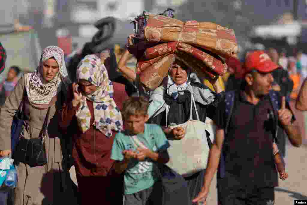 Displaced Palestinians flee the eastern part of Khan Younis following an Israeli army evacuation order in Khan Younis in the southern Gaza Strip.