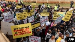 Climate activists hold banners and chant slogans as they march to demand drastic reduction in global plastic production ahead of the third meeting of the Intergovernmental Negotiating Committee (INC-3) in Nairobi, Kenya on Saturday November 11, 2023.