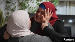 Released Palestinian prisoner Israa Jaabis is received by her family in her house in Jerusalem, amid a hostages-prisoners swap deal between Hamas and Israel, Nov. 26, 2023.