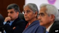 Indian Finance Minister Nirmala Sitharaman, center, addresses the media after a meeting of G20 finance chiefs and central bank governors in Gandhinagar, India, July 18, 2023.