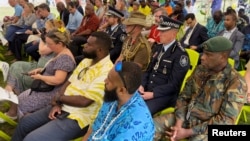 Servicemen attend a ceremony to repatriate five crates of sacred human relics, seized in New York by the FBI in 2016 from a deceased art collector, in Port Vila, Vanuatu Aug. 29, 2024