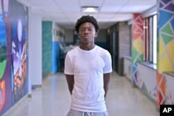 Flerentin “Flex” Jean-Baptiste, 16, of Medford, Mass., poses for a photo at Medford High School, Friday, Aug. 2, 2024, in Medford. (AP Photo/Josh Reynolds)