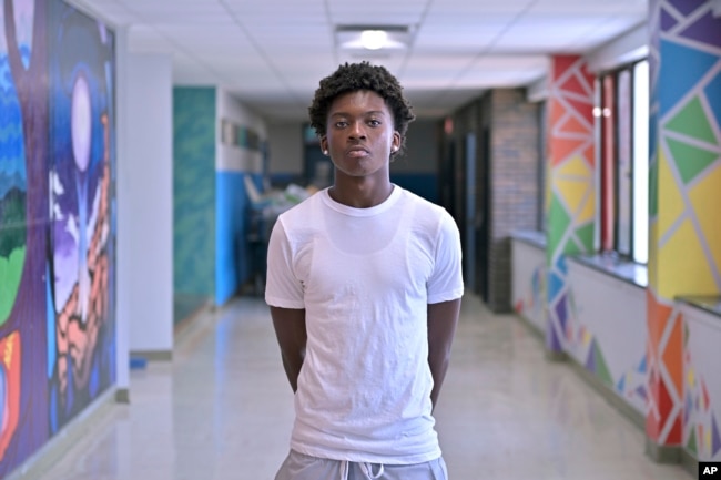 Flerentin “Flex” Jean-Baptiste, 16, of Medford, Mass., poses for a photo at Medford High School, Friday, Aug. 2, 2024, in Medford. (AP Photo/Josh Reynolds)