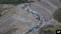 FILE - Ethnic Armenians flee Nagorno-Karabakh to Kornidzor, in Armenia's Syunik region, Sept. 26, 2023.