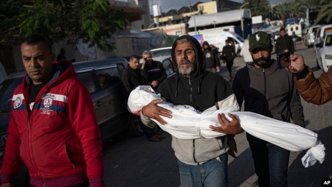 Palestinians mourn their relatives killed in the Israeli bombardment of the Gaza Strip, in the hospital in Khan Younis, Nov. 21, 2023.