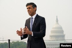 British Prime Minister Rishi Sunak speaks as he is interviewed with the U.S. Capitol Dome in the background during his trip to Washington, U.S., June 7, 2023.