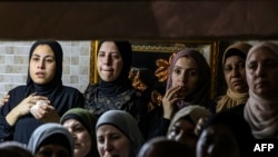 Palestinian women mourn during the funeral of Khalil Yahya Anis, 20, in the Al-Ain refugee camp near the West Bank city of Nablus, on June 15, 2023. 