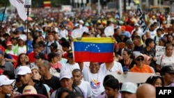 Supporters of President Nicolas Maduro take part in a march to defend the Law against Fascism, Neofascism and Similar Expressions in Caracas on Aug. 23, 2024.