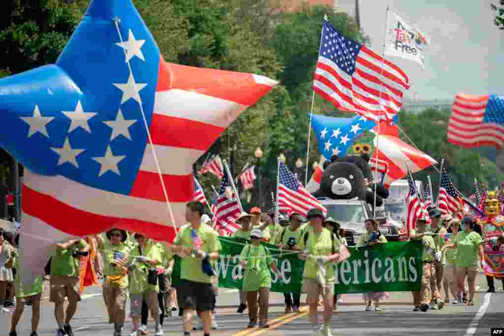 Participants march during the National Independence Day Parade in Washington, on July 4, 2023.