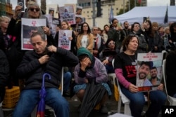 People attend a 24 hour rally calling for the release of the hostages kidnapped by Hamas militants into the Gaza Strip, in Tel Aviv, Israel, Jan. 14, 2024.