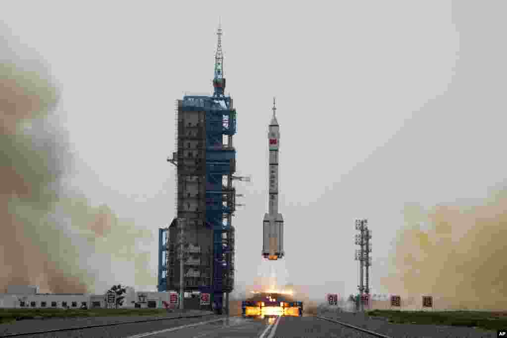 A Long March rocket carrying a crew of Chinese astronauts in a Shenzhou-16 spaceship lifts off at the Jiuquan Satellite Launch Center in northwestern China.