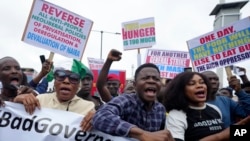 People protest Nigeria’s worst cost-of-living crisis, in Lagos, Aug. 1, 2024. 